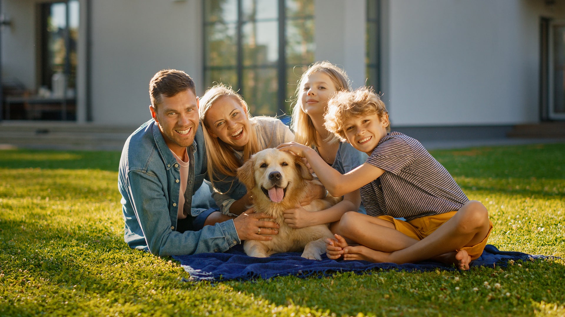 Family holding their dog