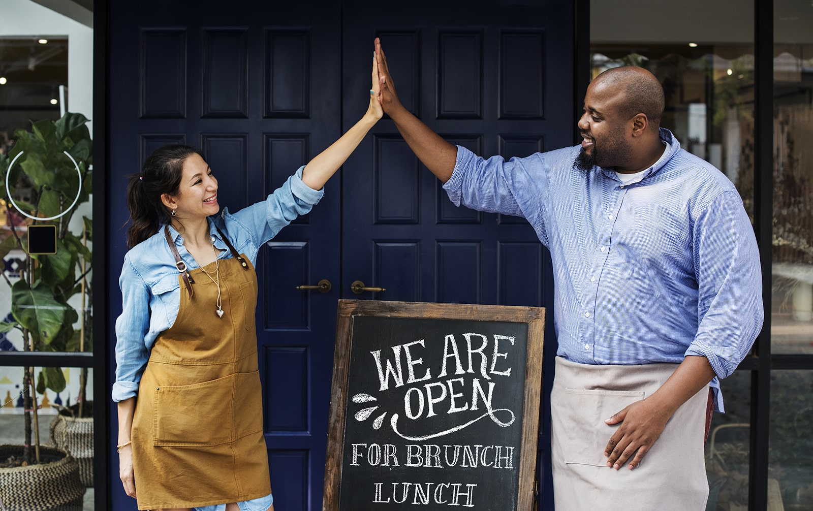 High-five between small business owners